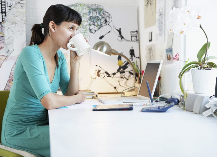 Woman at Desk working remotely on her laptop